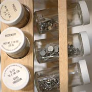 Spice jars are just the right size for storing small nails and such.