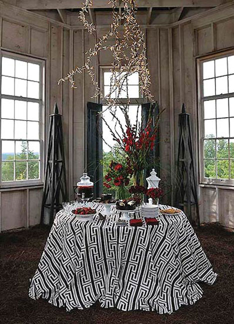 We kept it simple inside with a red, brown and white color palette. The table cloth is made from fabric in the Tobi Fairley Home Collection. The pattern is 'Athens'. Allen made the chandelier with branches and Christmas lights.
