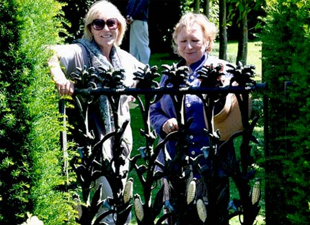 My friend Xa Tollemache and Carla Carlisle at Lady Carlisle's home Wyken Hall. They are standing behind the Cornstalk Gates. Love it!
