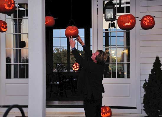 JackOLantern04 I dropped in LED tea lights before hanging the pumpkins. They don't give off that scent of candle warmed pumpkin, but they are safer and won't blow out.